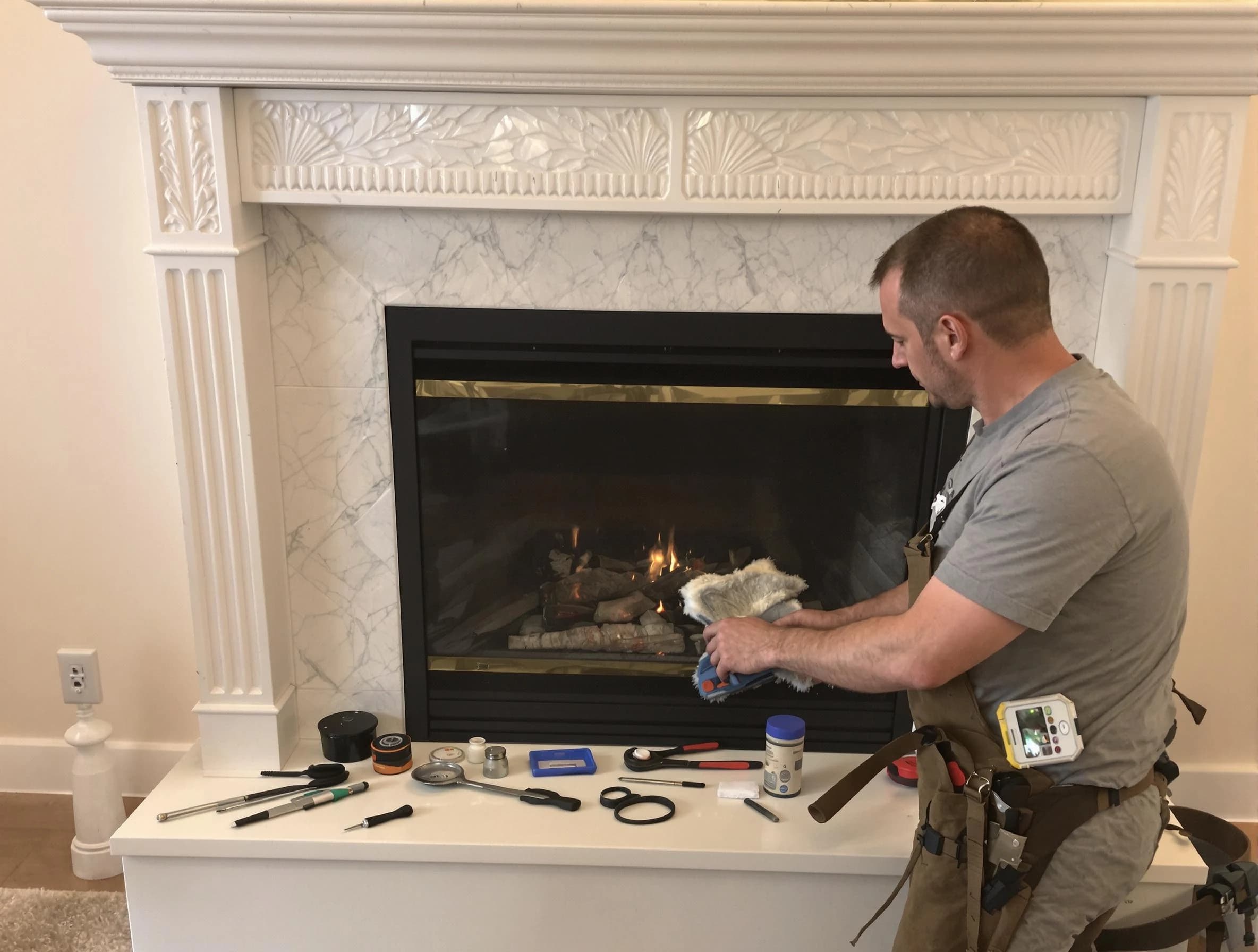 Newton Chimney Sweep performing fireplace maintenance in Newton, MA